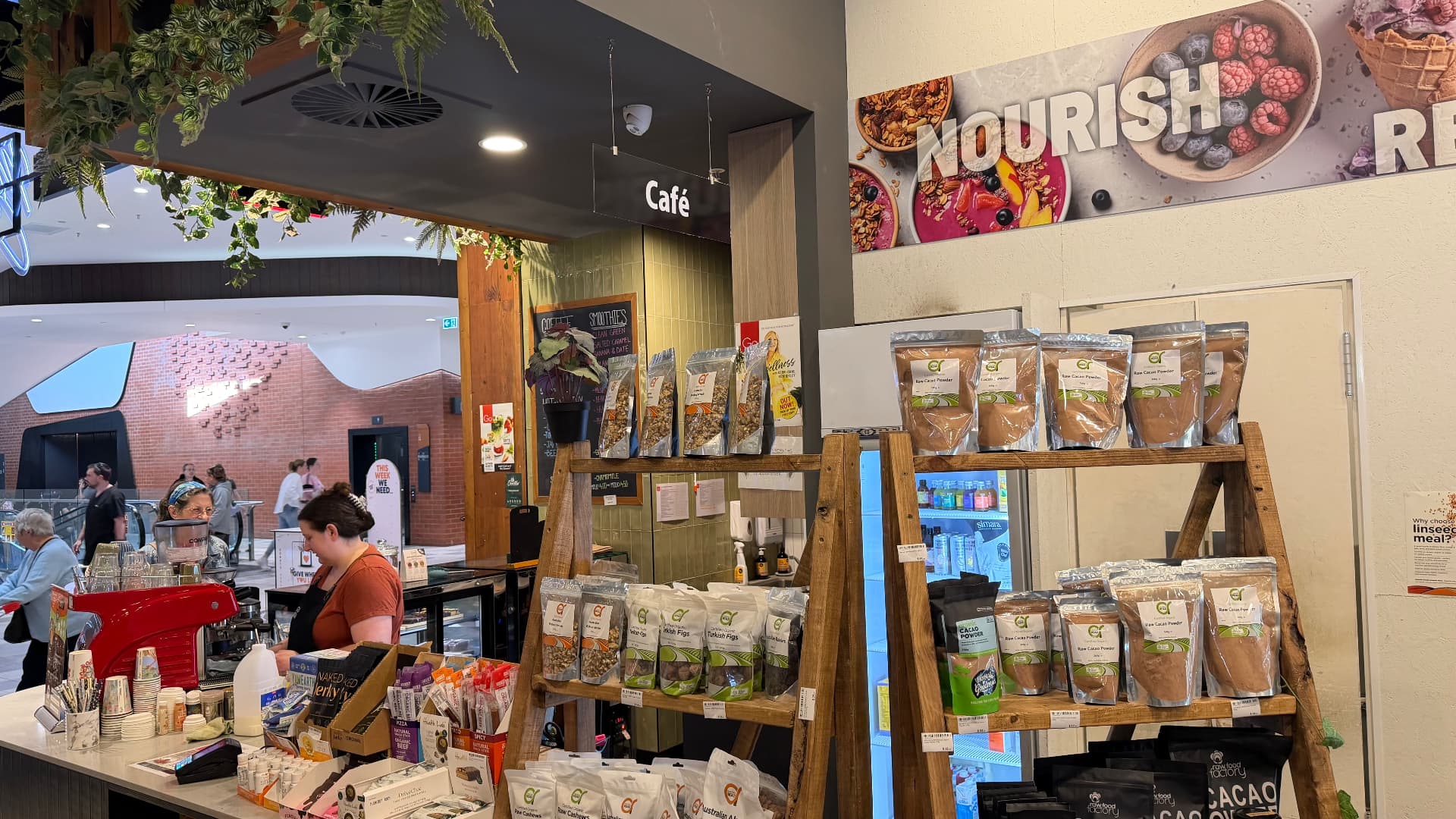 Go Vita café counter with coffee machine, snacks and cacao powders