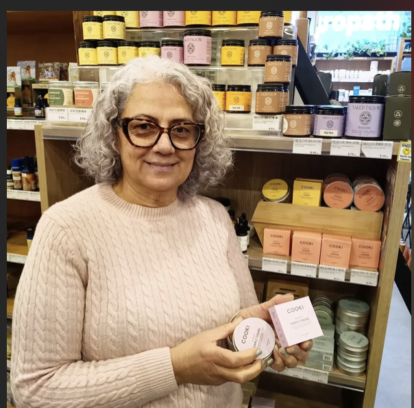 Store owner Rima holding Cooki shampoo and conditioner bars