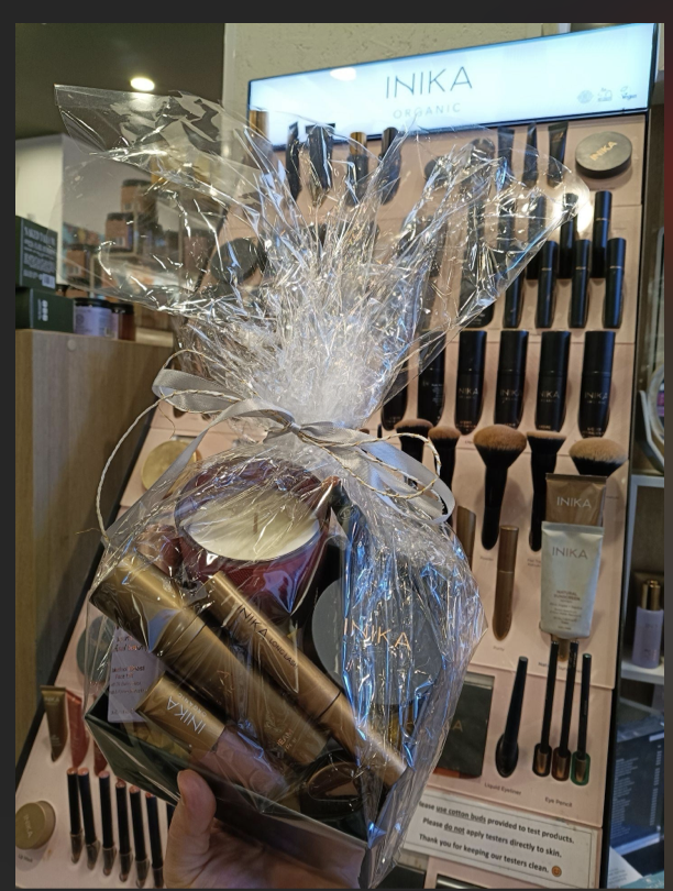 Inika and Raww makeup and skincare hamper wrapped as a giveaway prize